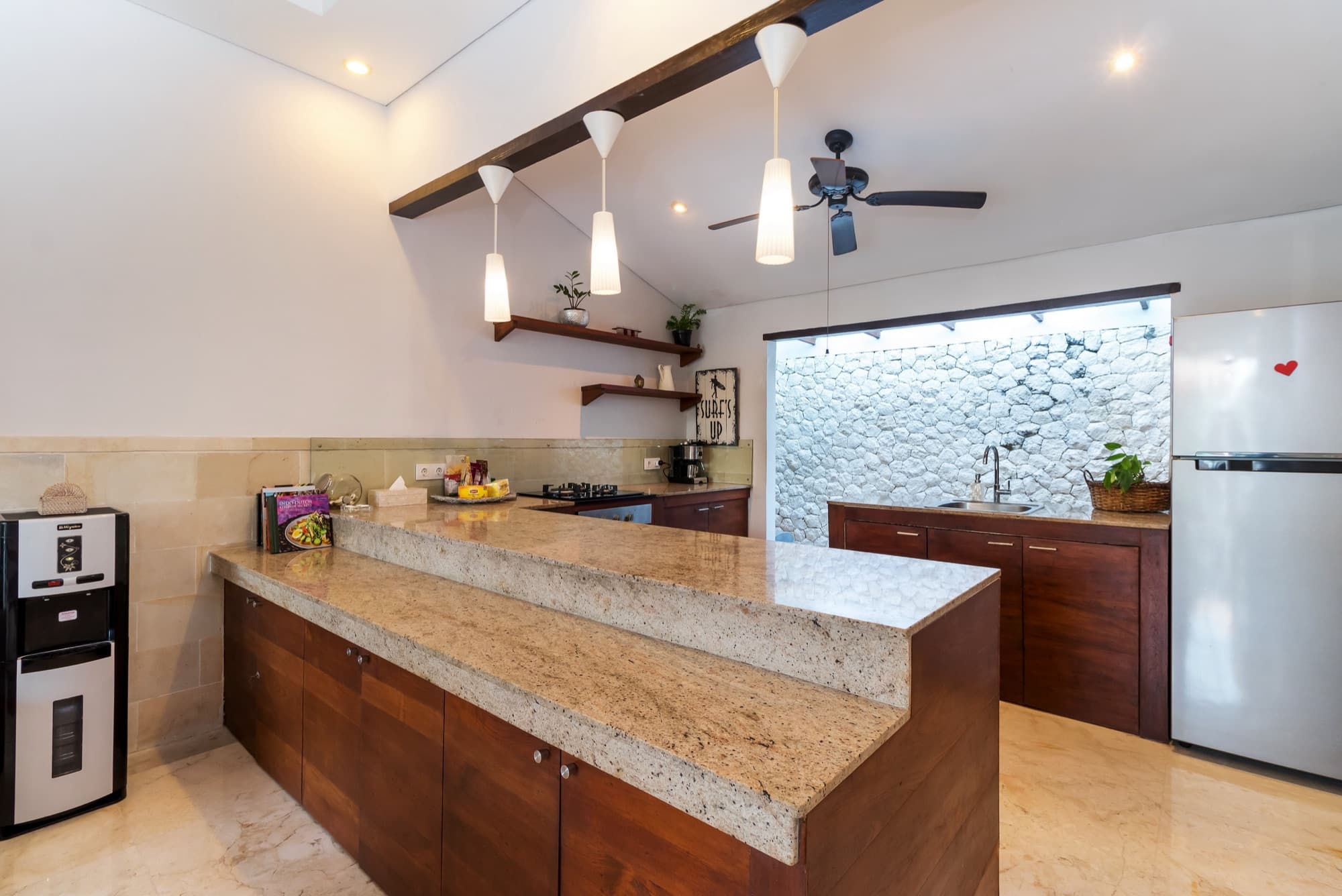 Villa Blue Bali — full kitchen with granite breakwater, pendant lights and white-stone wall