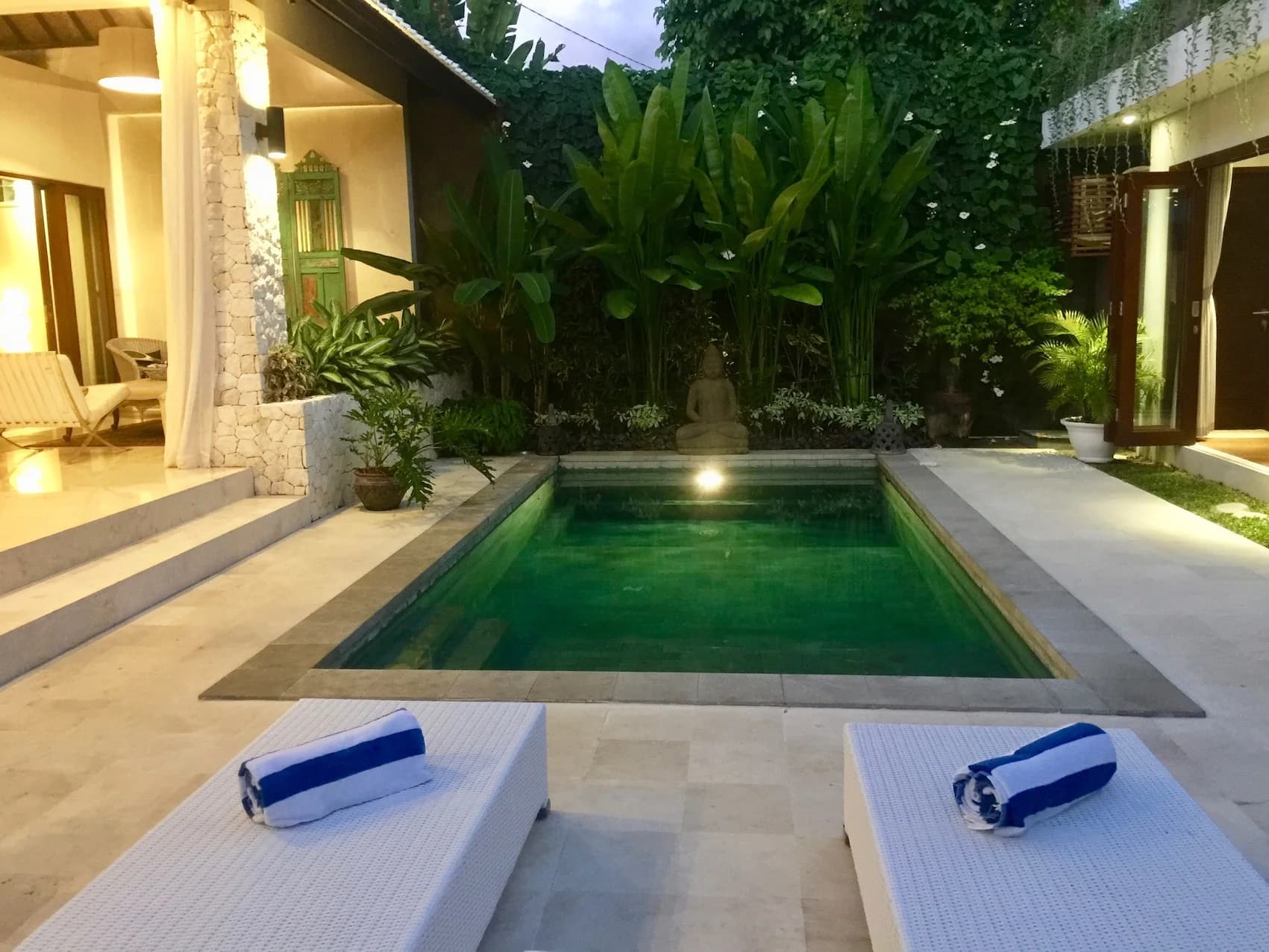 Villa Blue Bali — pool and loungers in evening light, towels rolled and ready
